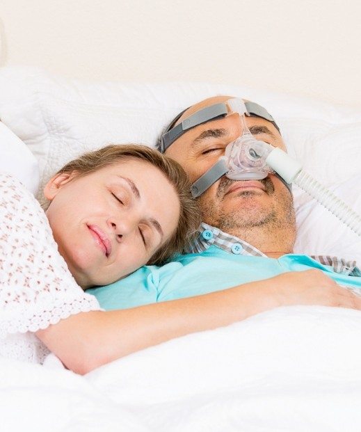 Sleeping man undergoing C P A P therapy in Dallas