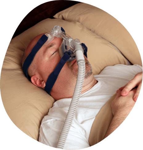 Man sleeping on his back with C P A P mask over his face