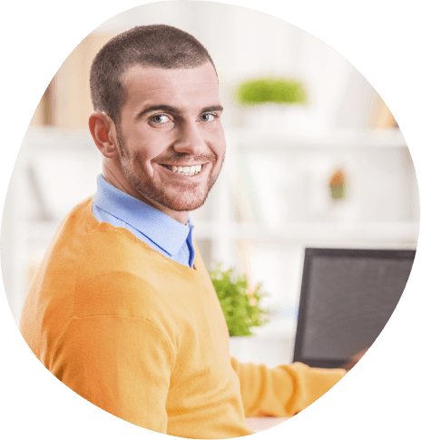 Smiling man in orange cardigan