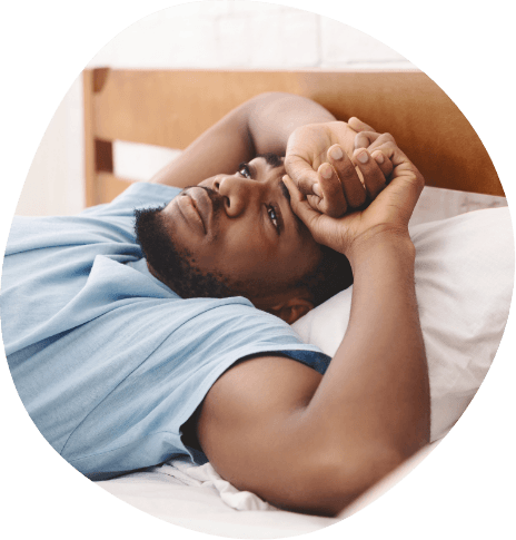 Man lying awake in bed