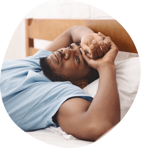 Man lying awake in bed
