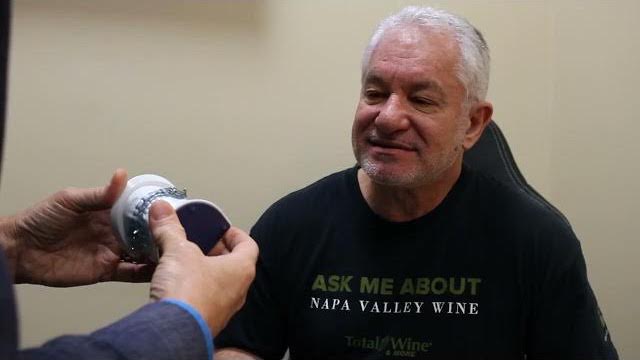 Man receiving oral appliance from Dallas sleep doctor