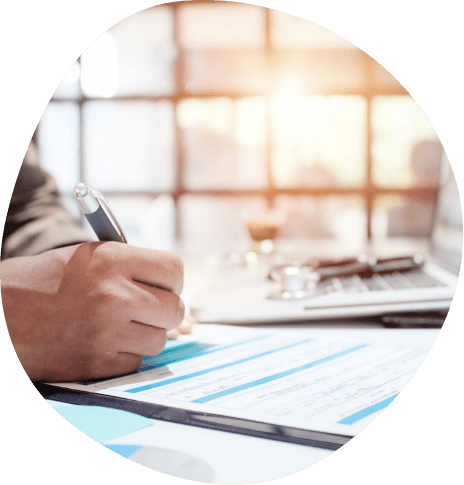 Person filling out an insurance form on a clipboard