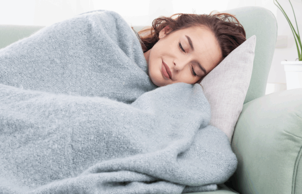 Woman sleeping with weighted blanket