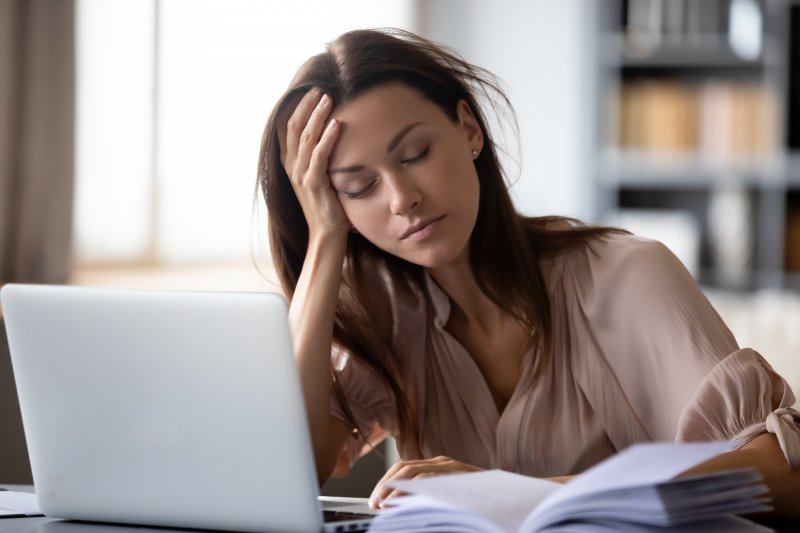 a woman tired at work